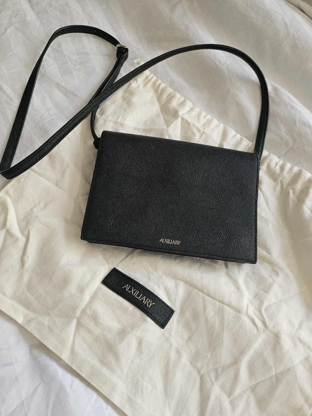 Auxiliary Black Pebbled Leather Crossbody Bag with Gold Logo